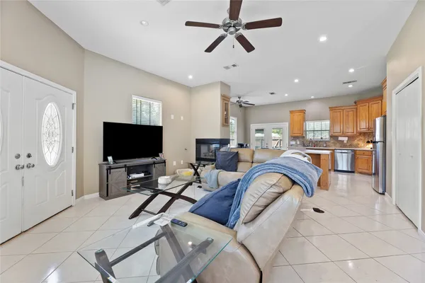 a living room with furniture and a flat screen tv