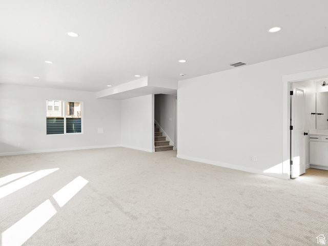 1711 West Canyon Rim Road North Lehi, UT 84048 - Photo 21 of 31 Spacious room featuring light-colored carpeting, recessed lighting, and a window providing natural illumination