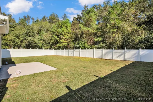 a view of yard with swimming pool