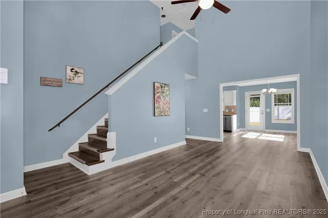 a view of an entryway with wooden floor