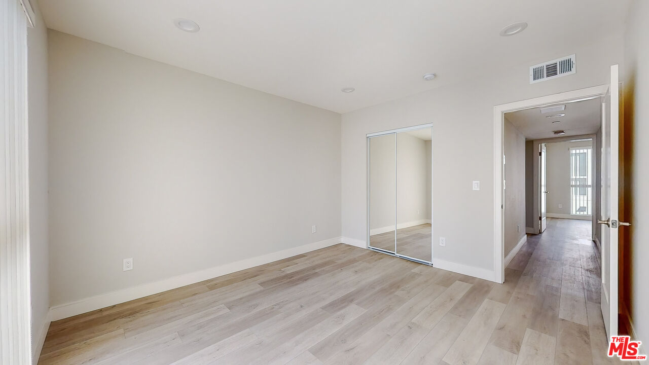 252 Rosemont Avenue, Unit 1/2 Los Angeles, CA 90026 - Photo 15 of 30 a view of a room with wooden floor