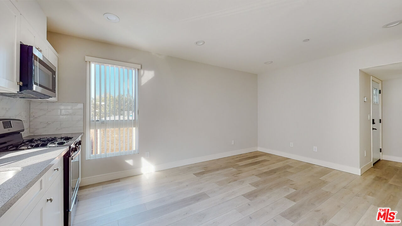 252 Rosemont Avenue, Unit 1/2 Los Angeles, CA 90026 - Photo 4 of 30 a view of kitchen and wooden floor