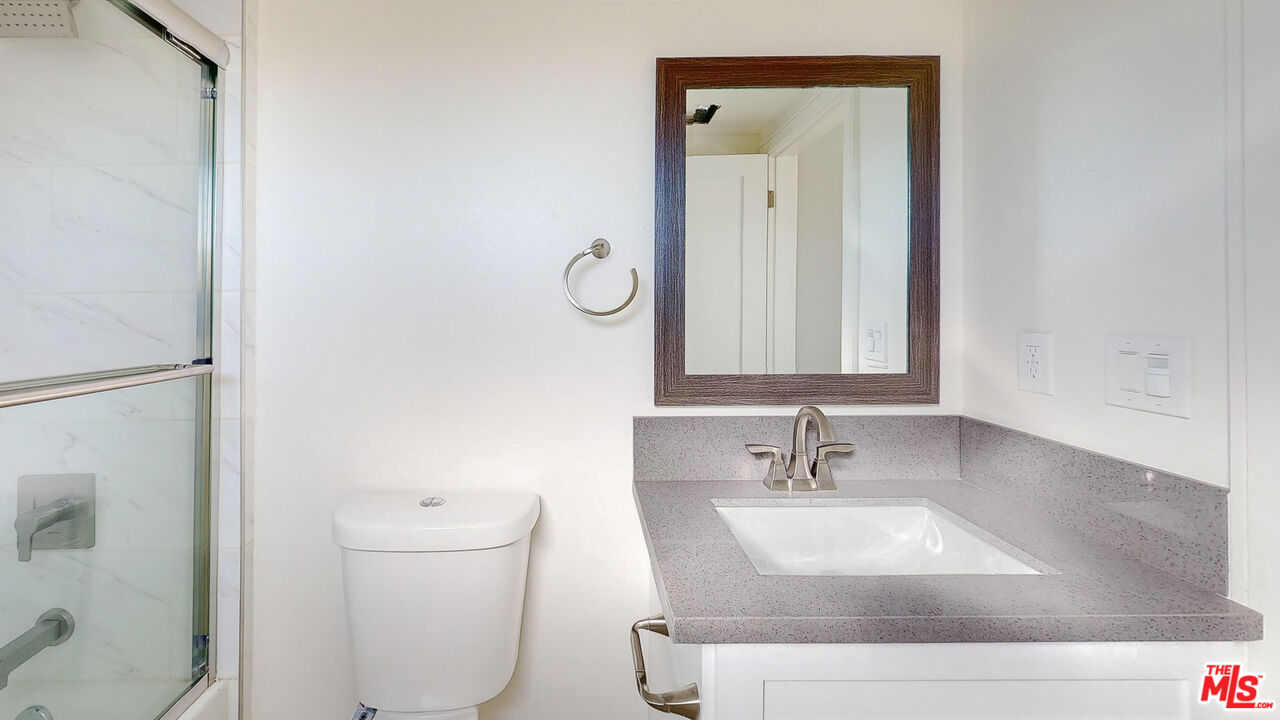 252 Rosemont Avenue, Unit 1/2 Los Angeles, CA 90026 - Photo 10 of 30 a bathroom with a sink and a mirror