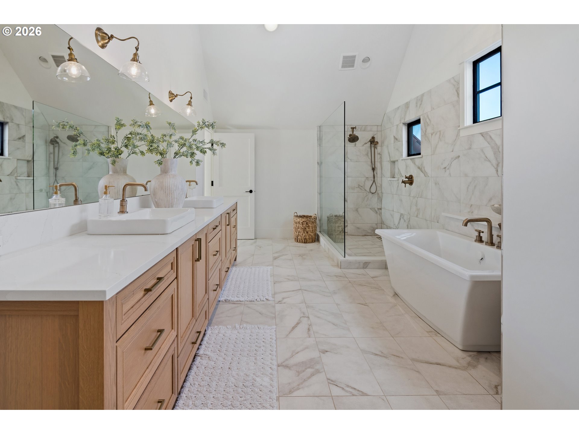 554 Northwest Dawson Ridge Drive Camas, WA 98607 - Photo 20 of 48 a spacious bathroom with a double vanity sink a large mirror and a bathtub