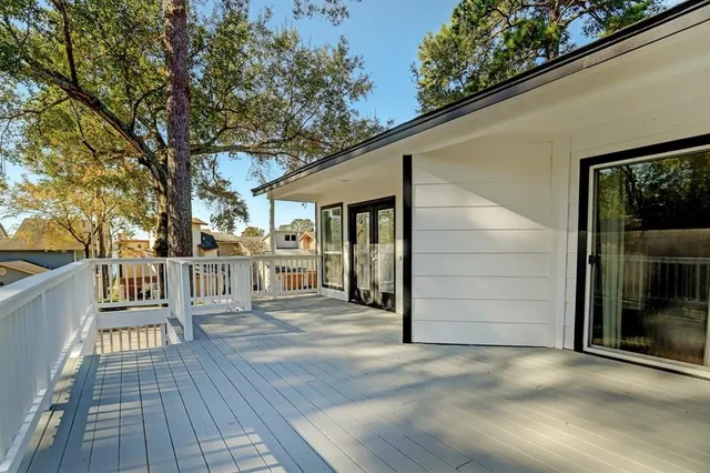 a view of a house with wooden floor and fence