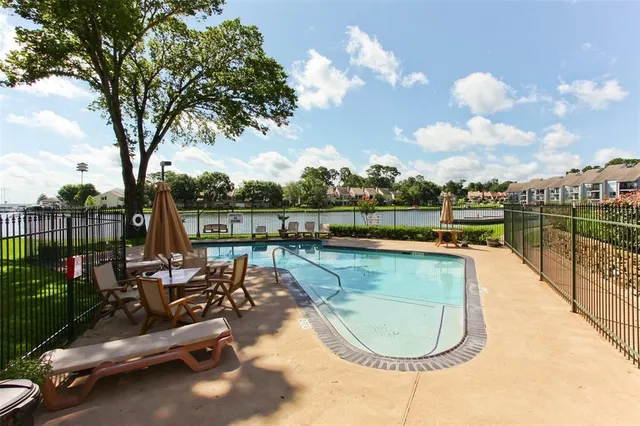 a view of a swimming pool with a lounge chairs