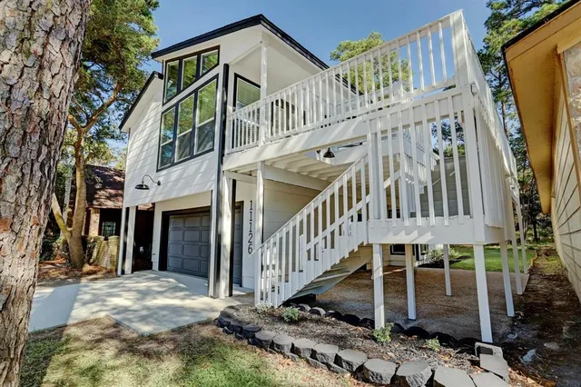 a view of a house with wooden stairs
