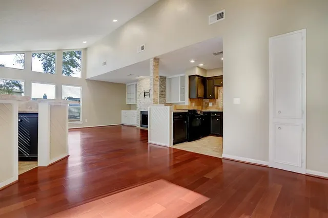 a view of kitchen with cabinets and wooden floor