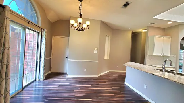 a view of a kitchen from the hallway