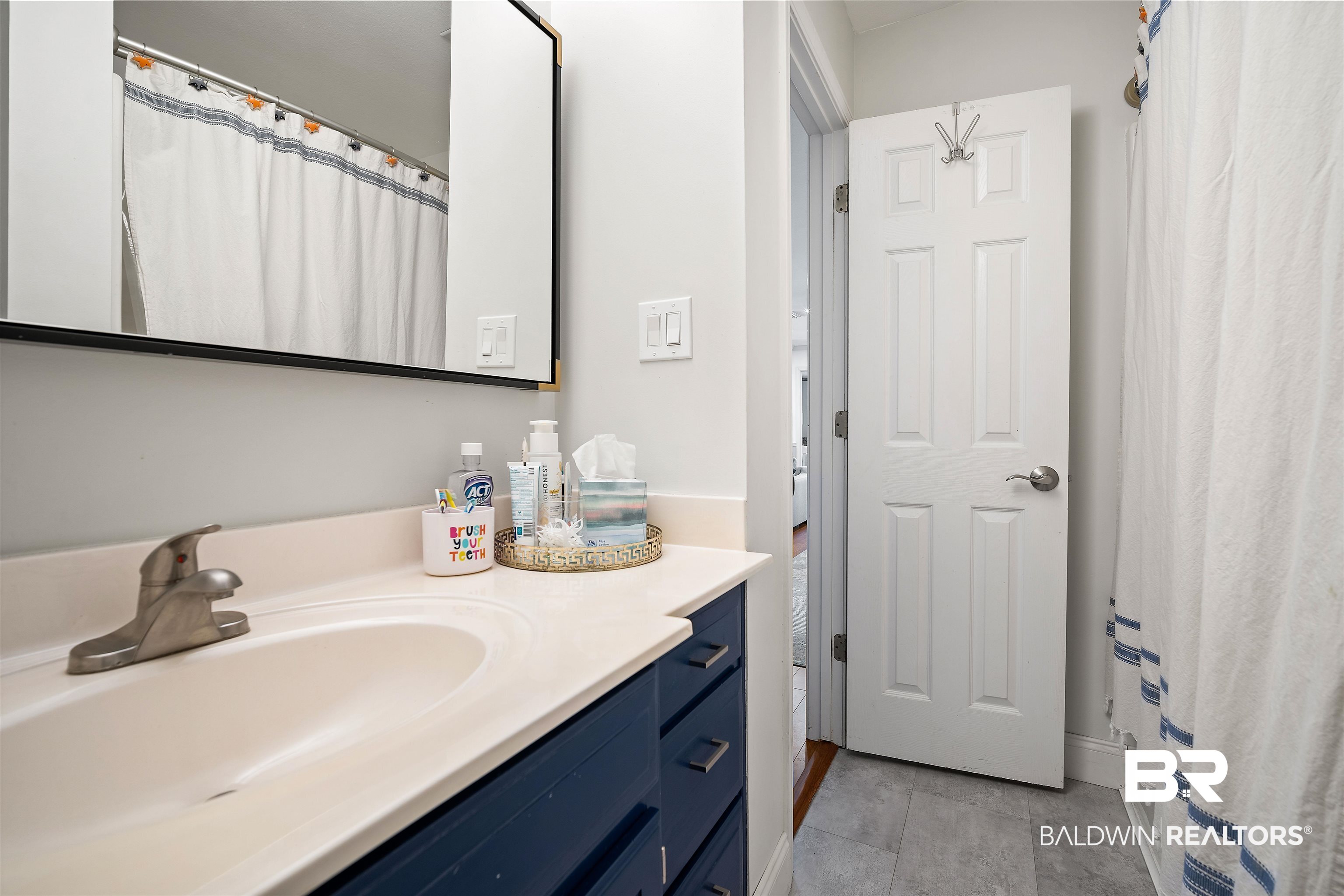 808 Michigan Avenue Fairhope, AL 36532 - Photo 23 of 33 Bathroom featuring tile patterned floors and vanity