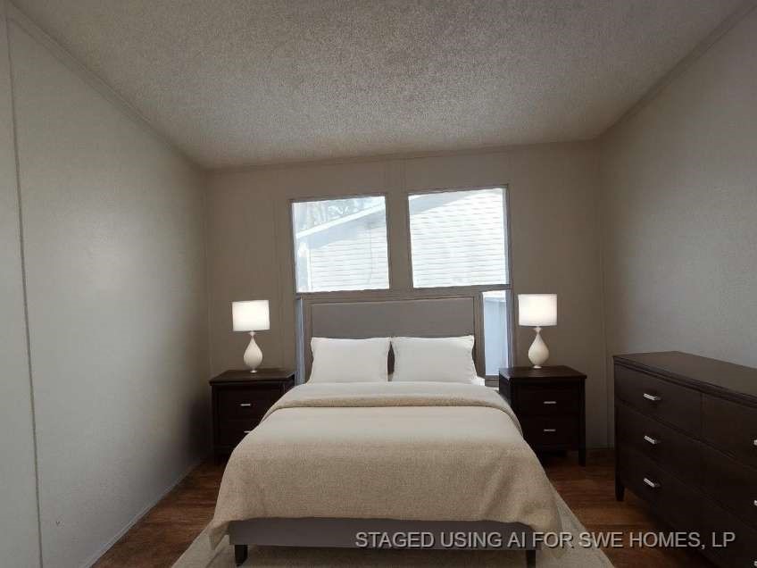 5815 Dylan Drive Baytown, TX 77521 - Photo 5 of 7 a bedroom with a bed and window