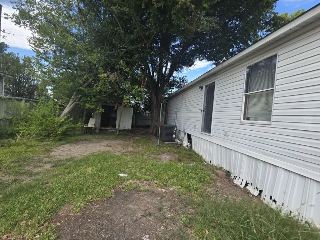5815 Dylan Drive Baytown, TX 77521 - Photo 7 of 7 a view of a backyard with large trees