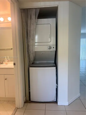a utility room with washer and dryer