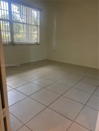 an empty room and windows