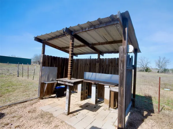 a patio with table and chairs