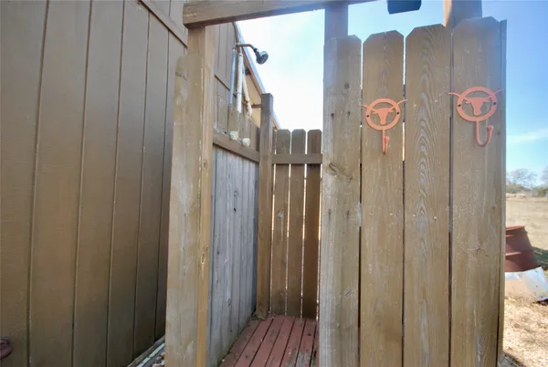 a view of a wooden door with a glass door