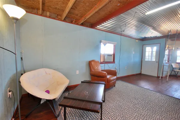 a room with furniture and wooden floor