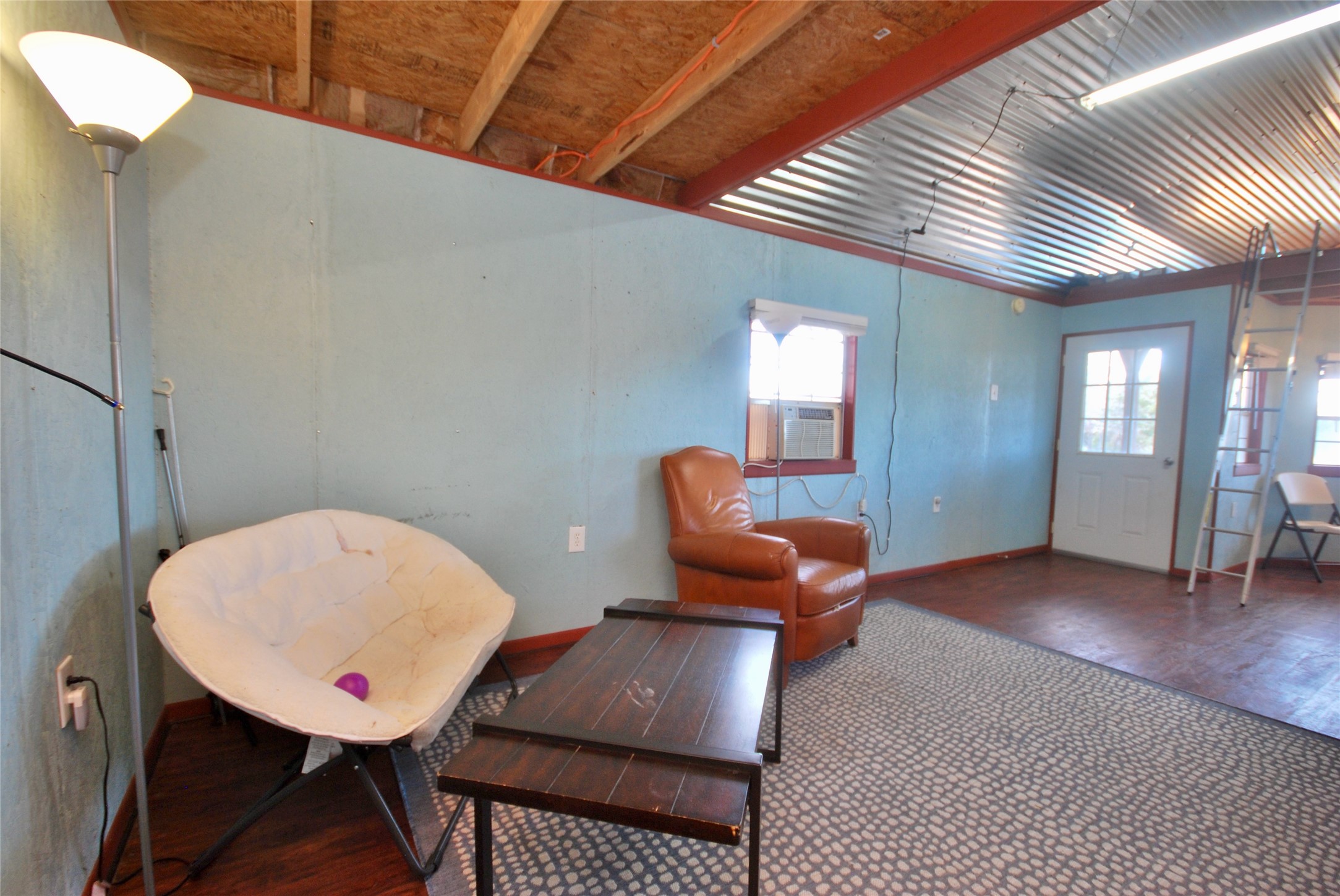 4850 Burke Road Flatonia, TX 78941 - Photo 15 of 45 a room with furniture and wooden floor