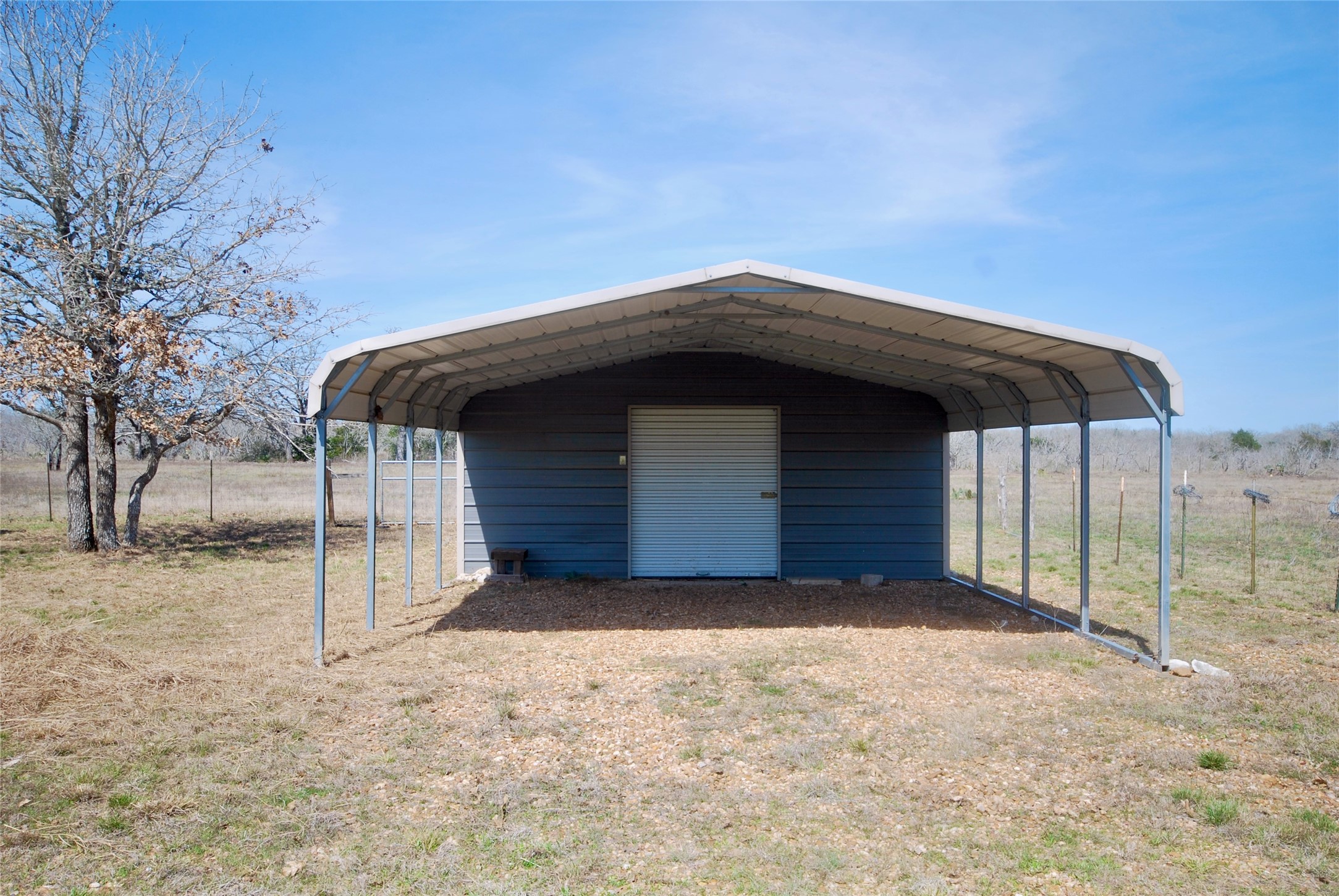 4850 Burke Road Flatonia, TX 78941 - Photo 24 of 45 a view of backyard with a barn