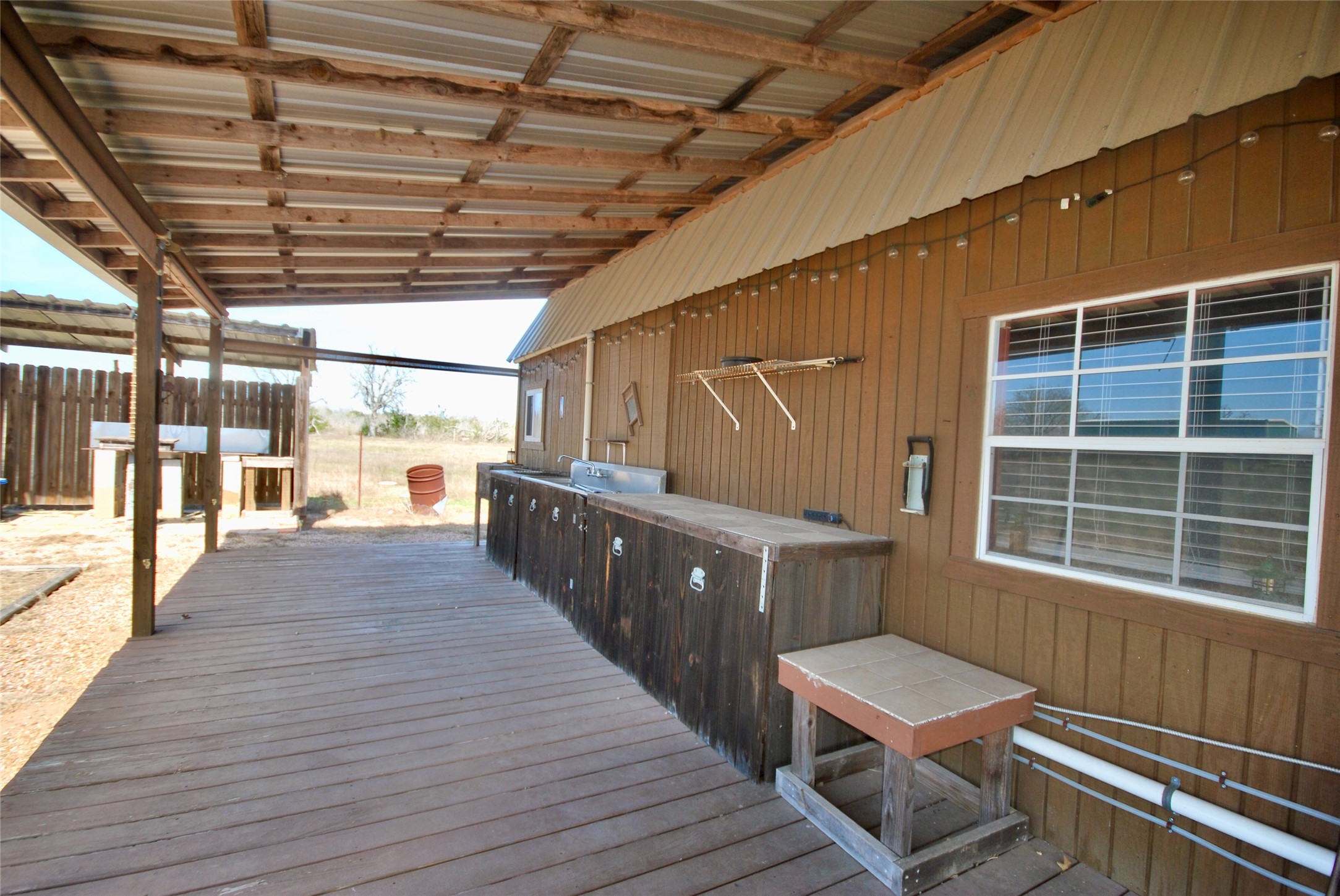 4850 Burke Road Flatonia, TX 78941 - Photo 10 of 45 a view of a bathroom with wooden floor and iron stairs