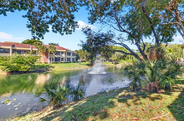 a view of a lake with a house in the background
