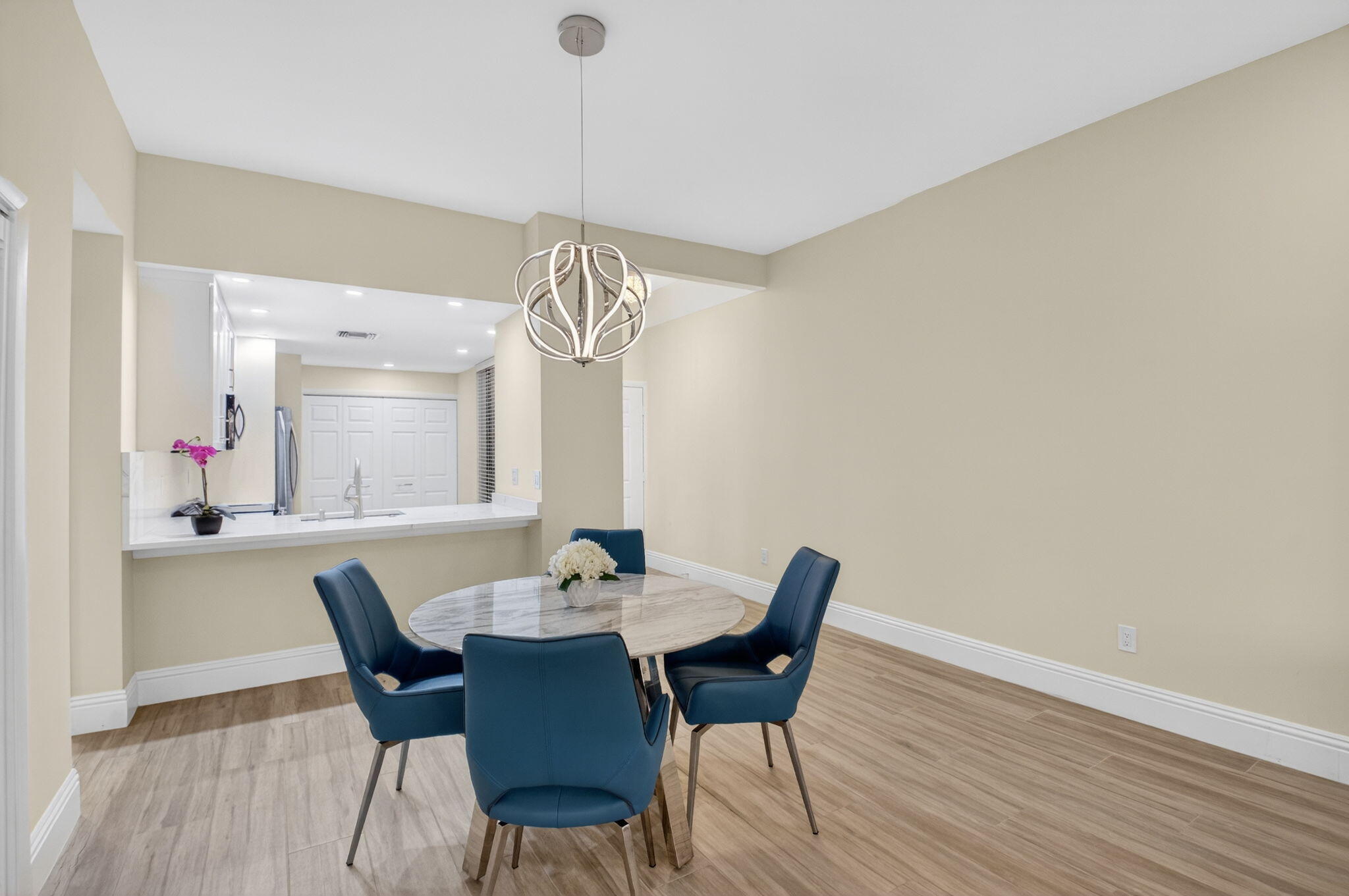 7484 La Paz Boulevard, Unit 103 Boca Raton, FL 33433 - Photo 11 of 50 a view of a dining room with furniture and wooden floor