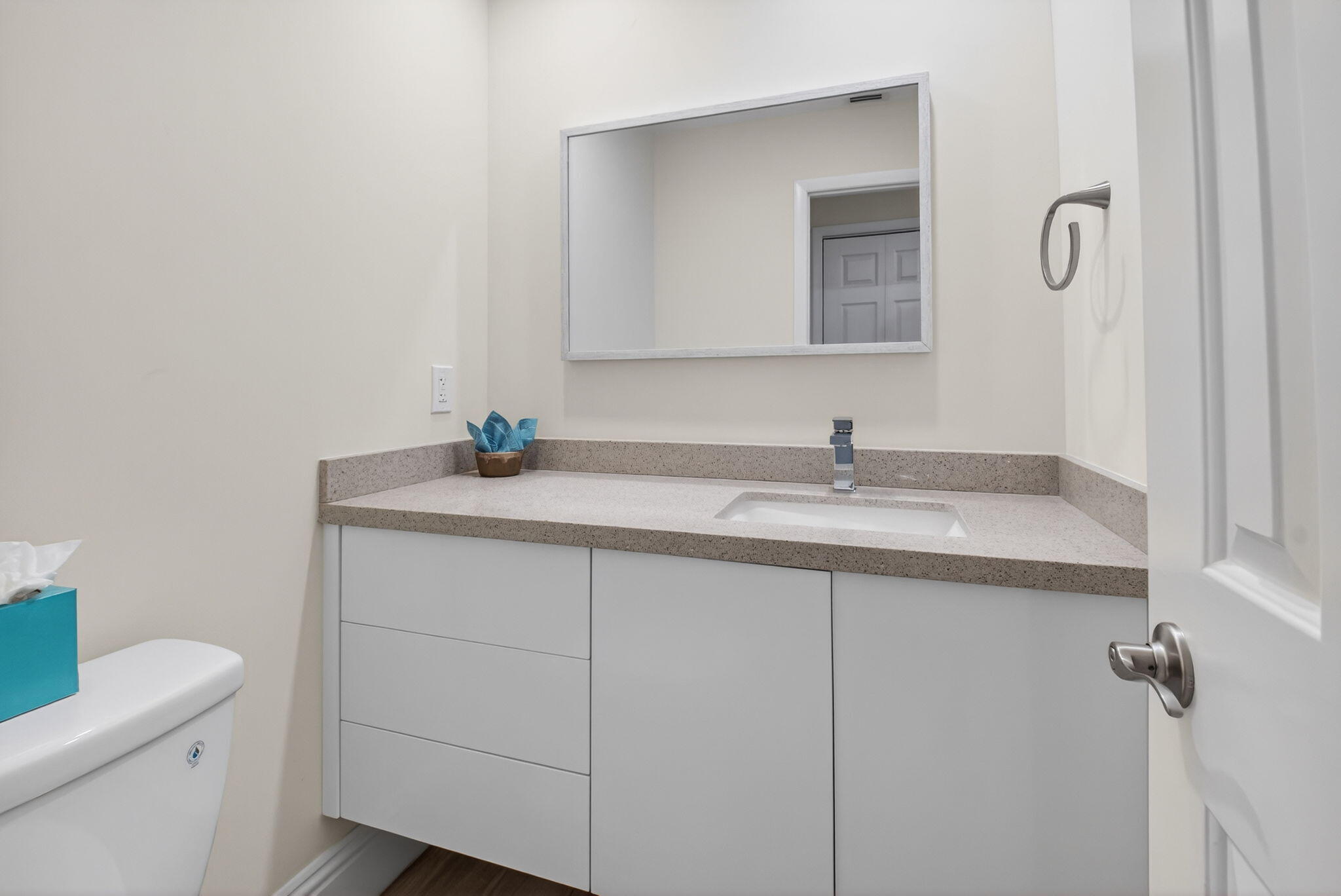 7484 La Paz Boulevard, Unit 103 Boca Raton, FL 33433 - Photo 22 of 50 a bathroom with a sink a toilet and a mirror