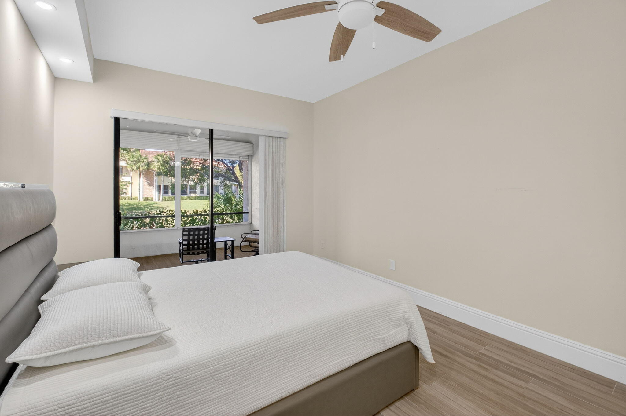 7484 La Paz Boulevard, Unit 103 Boca Raton, FL 33433 - Photo 26 of 50 a bedroom with a bed and a window