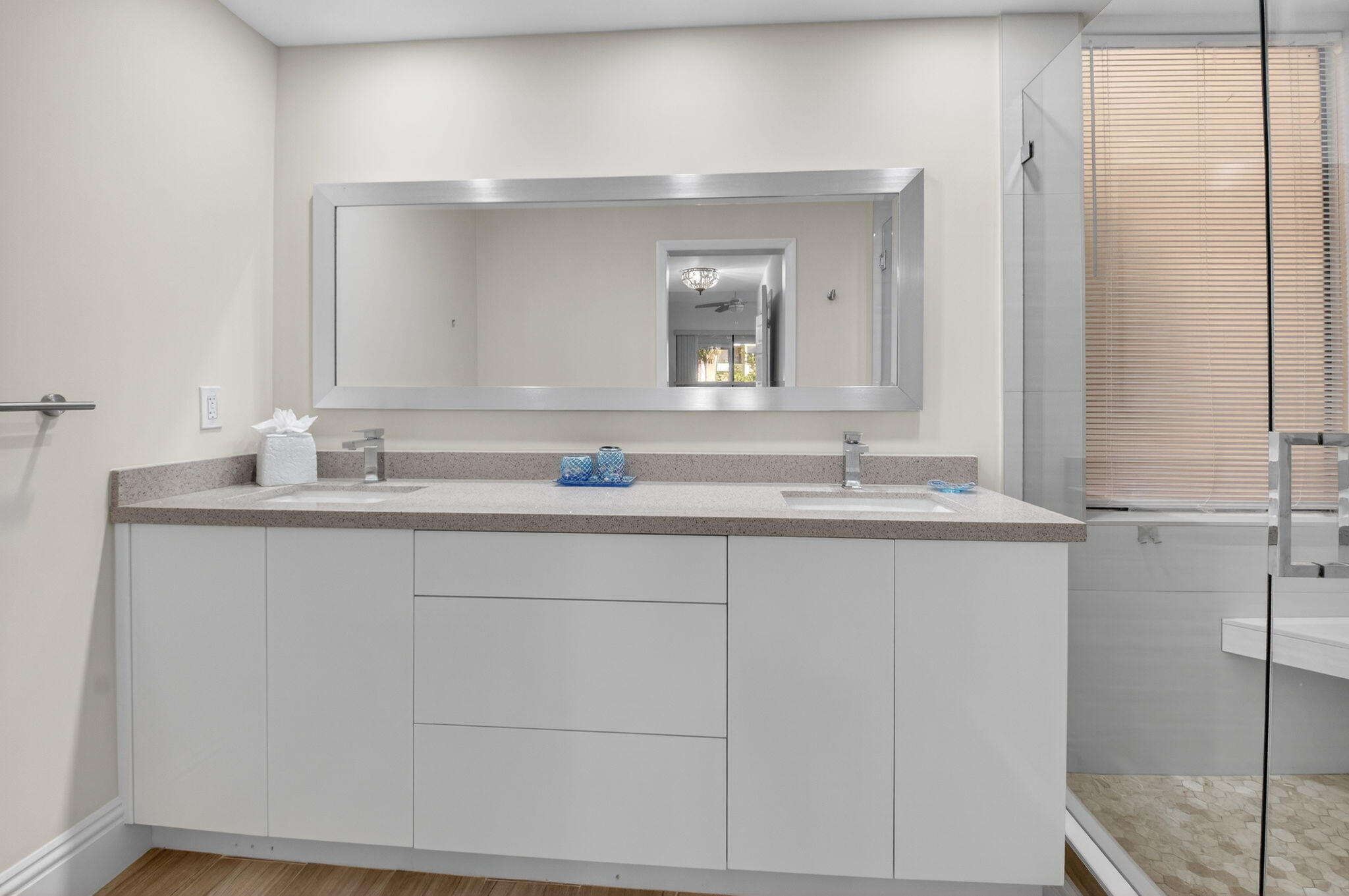 7484 La Paz Boulevard, Unit 103 Boca Raton, FL 33433 - Photo 29 of 50 a bathroom with a sink and a mirror