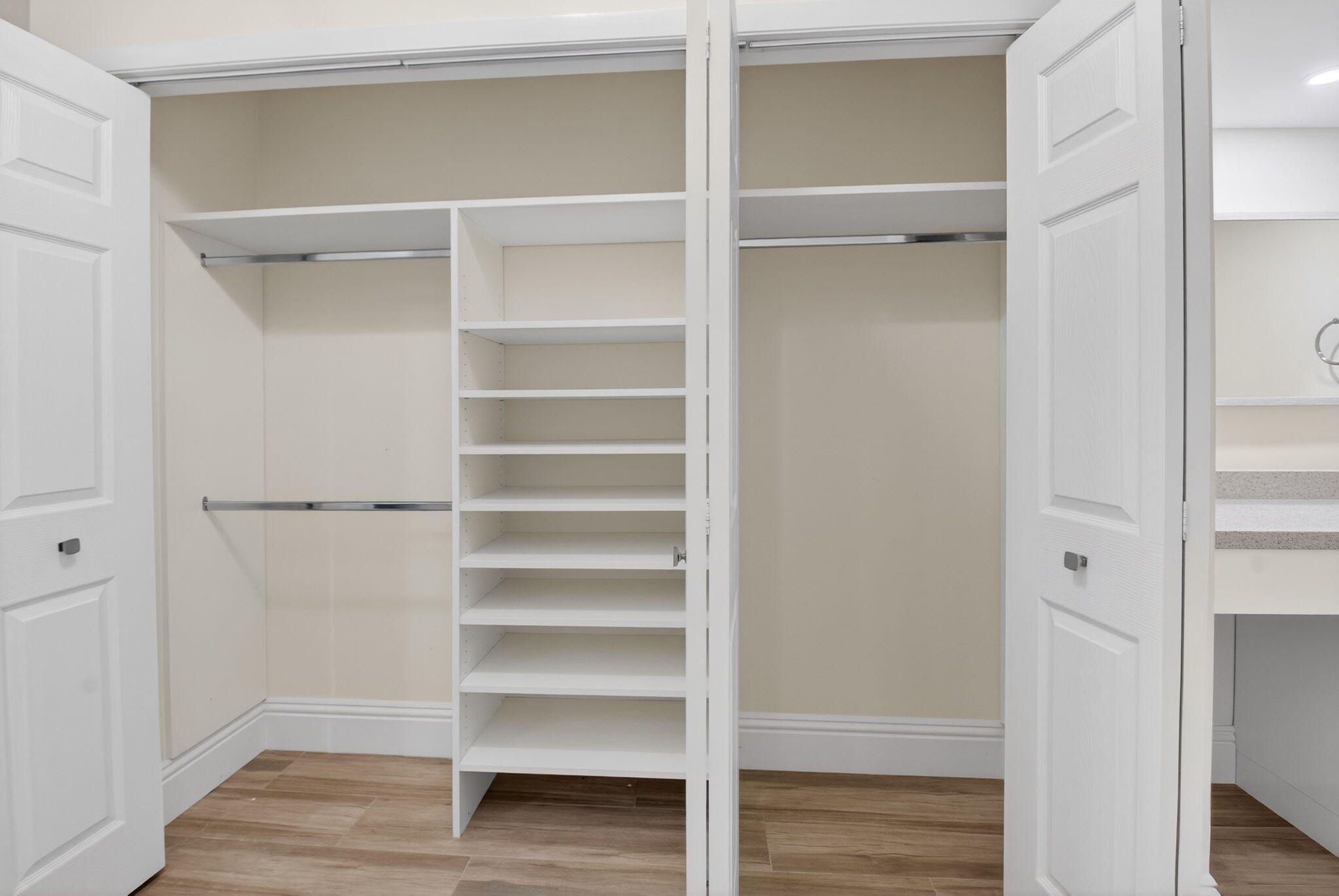 7484 La Paz Boulevard, Unit 103 Boca Raton, FL 33433 - Photo 31 of 50 a view of walk in closet with empty racks