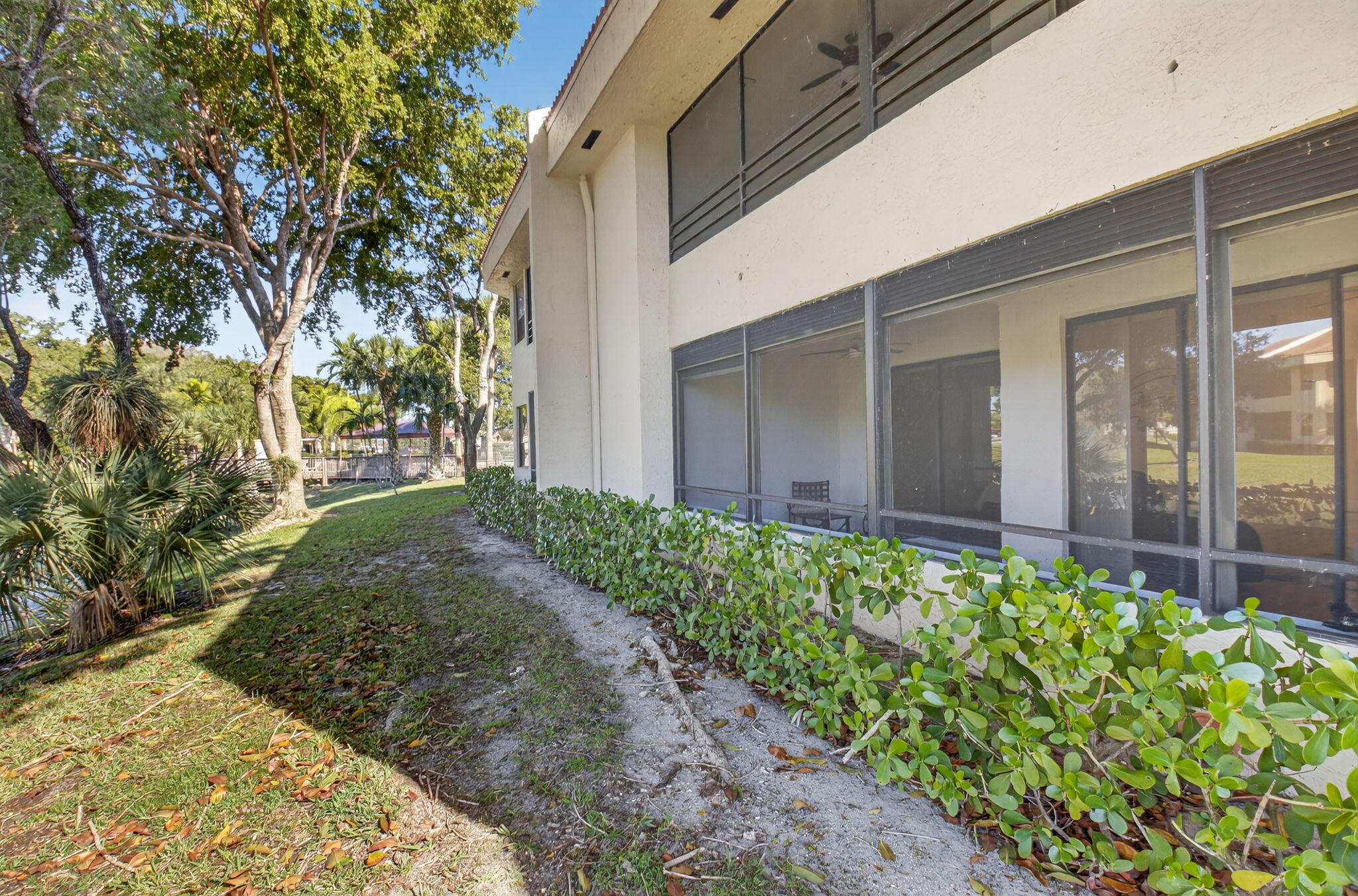 7484 La Paz Boulevard, Unit 103 Boca Raton, FL 33433 - Photo 33 of 50 a view of a backyard of the house