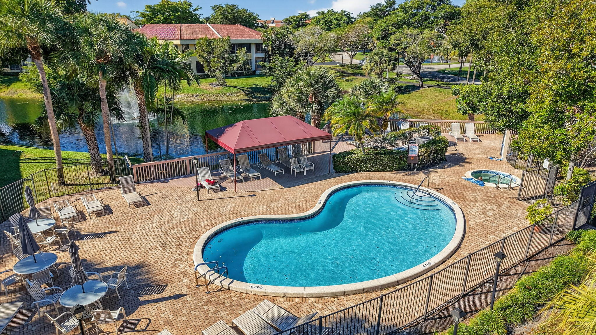 7484 La Paz Boulevard, Unit 103 Boca Raton, FL 33433 - Photo 36 of 50 an outdoor space with seating area and trees