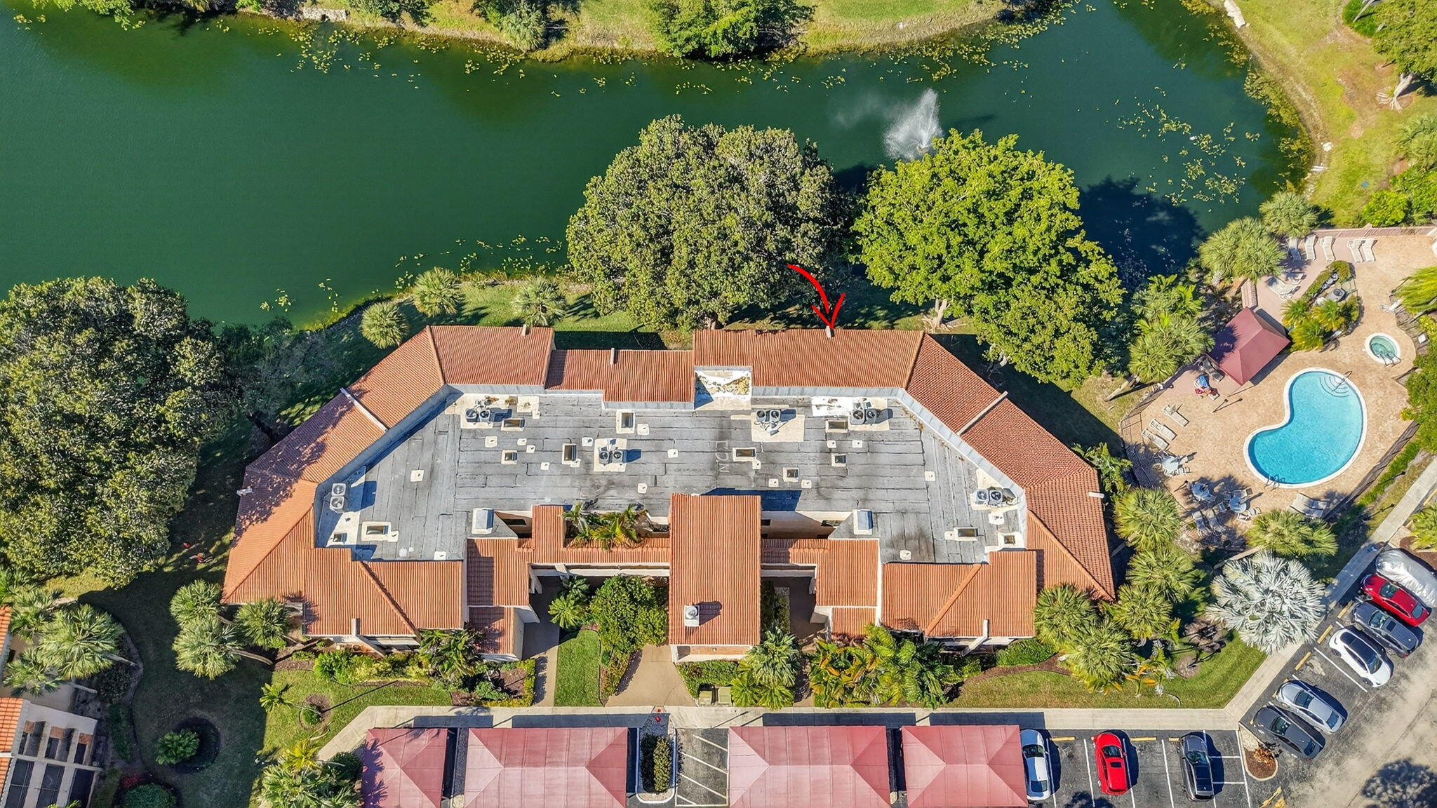 7484 La Paz Boulevard, Unit 103 Boca Raton, FL 33433 - Photo 42 of 50 an aerial view of a house with a yard and lake view