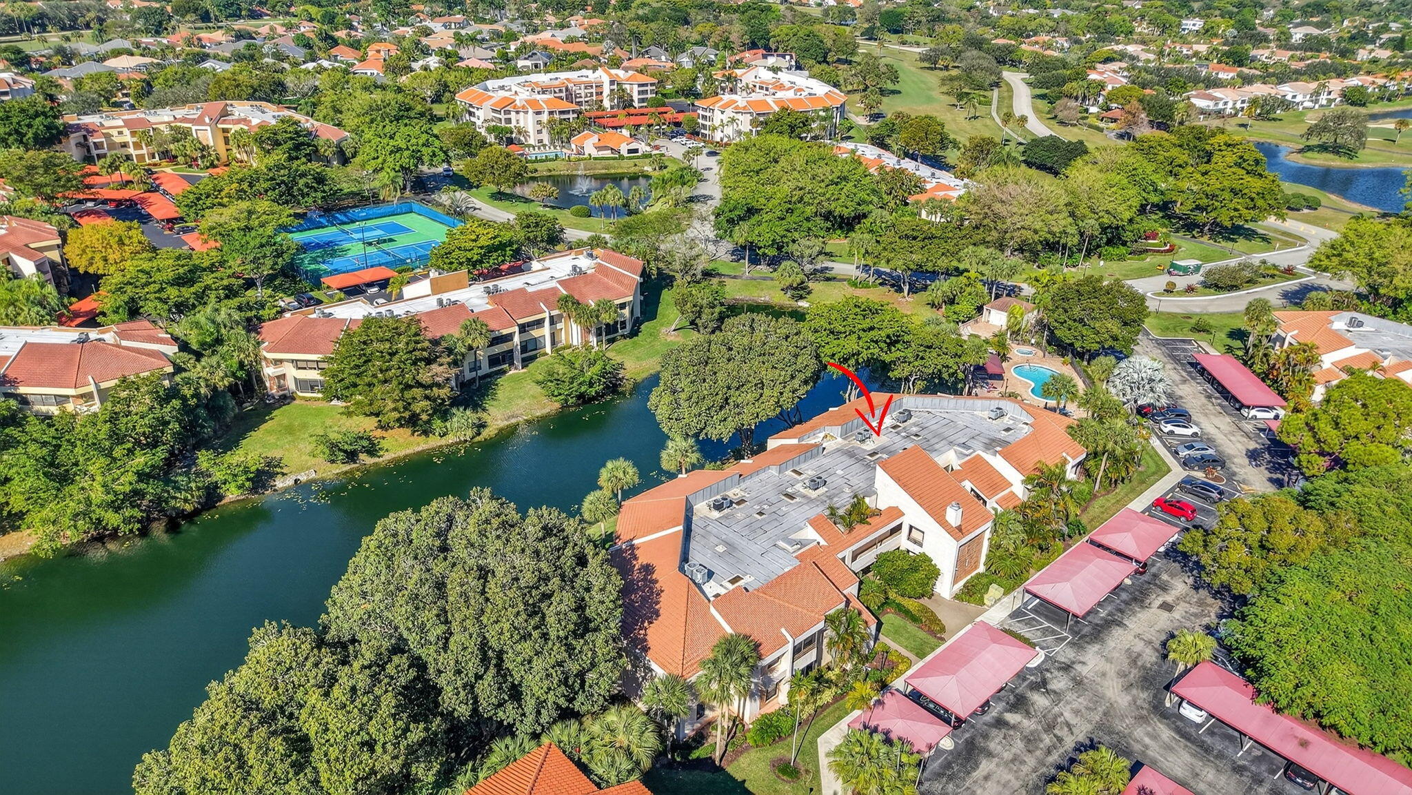 7484 La Paz Boulevard, Unit 103 Boca Raton, FL 33433 - Photo 44 of 50 an aerial view of residential houses with outdoor space and lake view