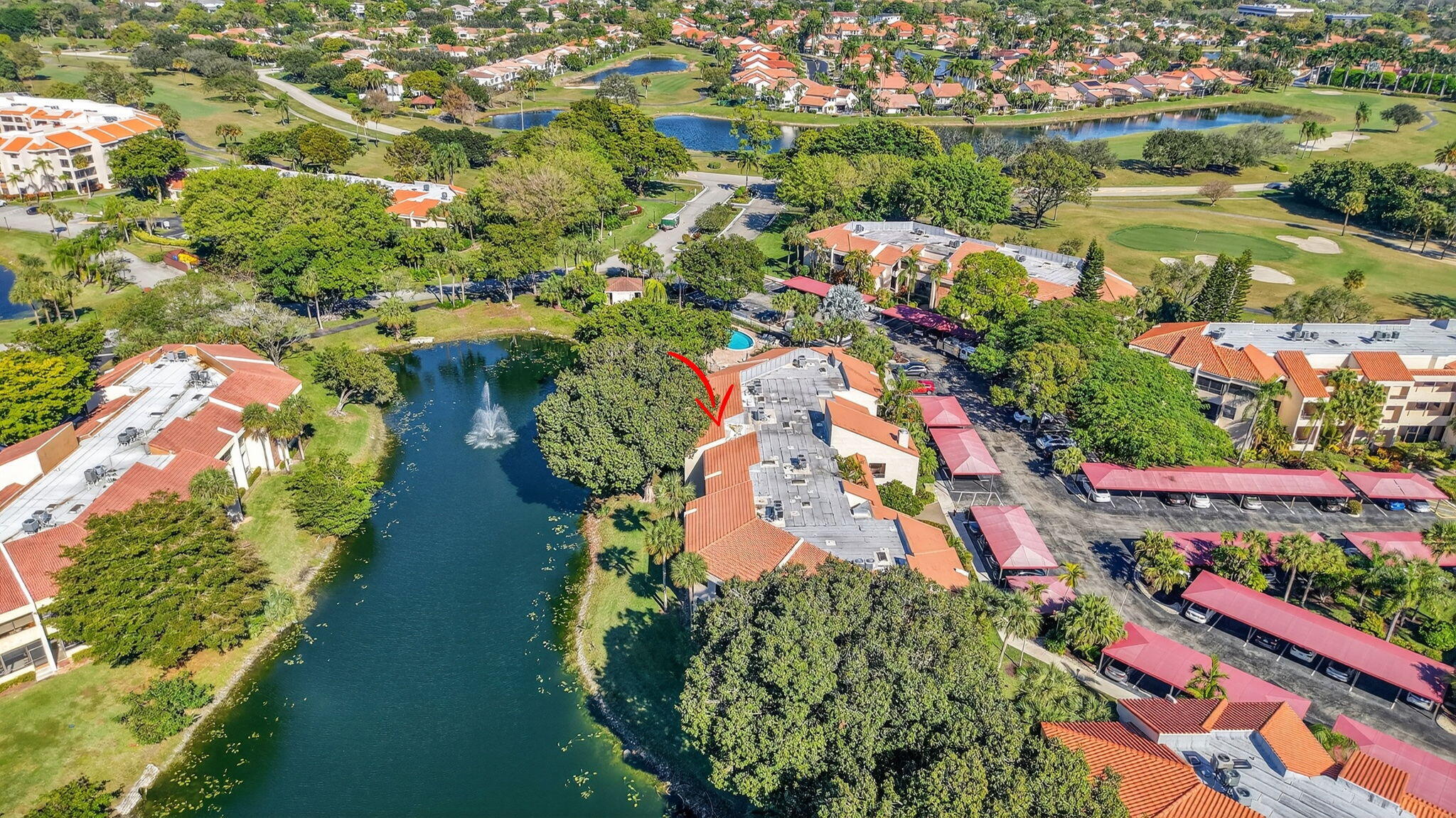 7484 La Paz Boulevard, Unit 103 Boca Raton, FL 33433 - Photo 45 of 50 an aerial view of residential houses with outdoor space