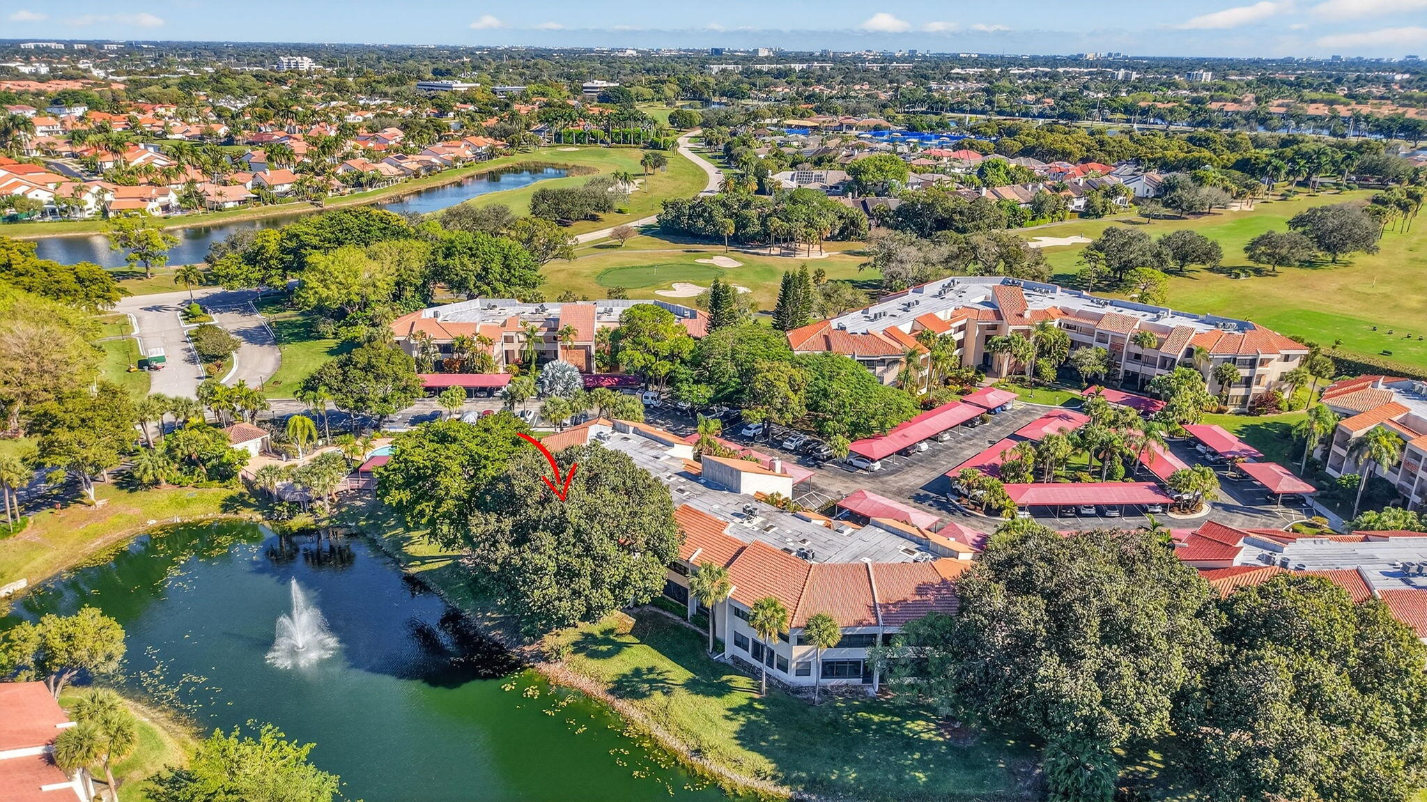 7484 La Paz Boulevard, Unit 103 Boca Raton, FL 33433 - Photo 46 of 50 an aerial view of lake and residential houses with outdoor space
