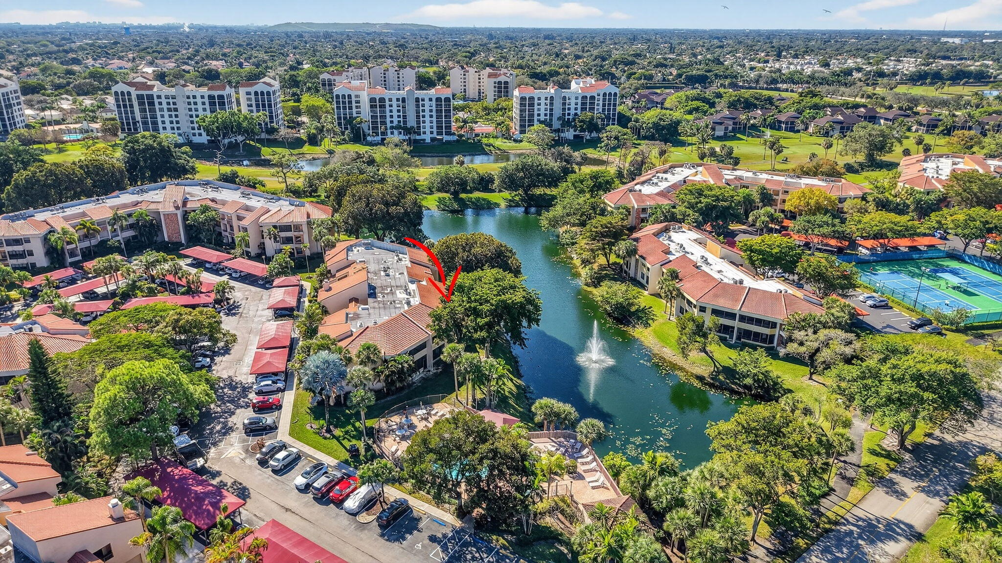 7484 La Paz Boulevard, Unit 103 Boca Raton, FL 33433 - Photo 49 of 50 an aerial view of residential houses with outdoor space