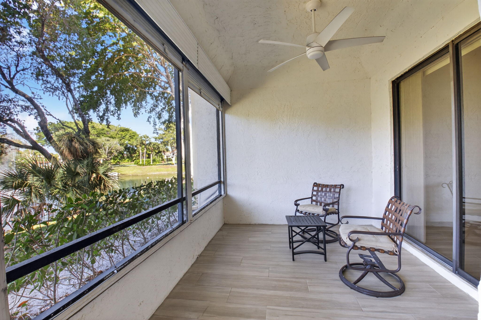 7484 La Paz Boulevard, Unit 103 Boca Raton, FL 33433 - Photo 8 of 50 a view of a chairs and table in a balcony