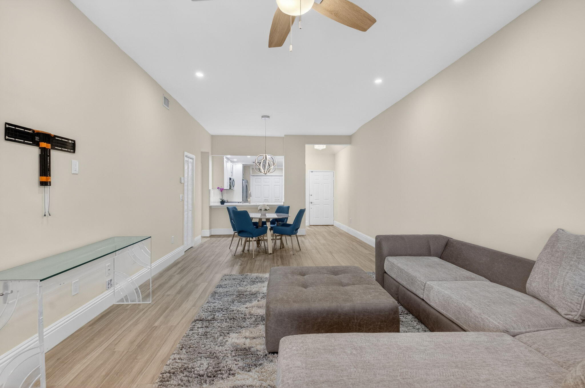 7484 La Paz Boulevard, Unit 103 Boca Raton, FL 33433 - Photo 10 of 50 a living room with furniture and a rug