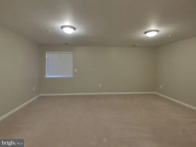 an empty room with a empty space and window