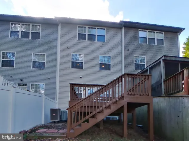 a view of balcony with deck and wooden floor