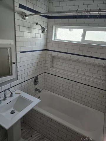 a bathroom with a sink and a shower