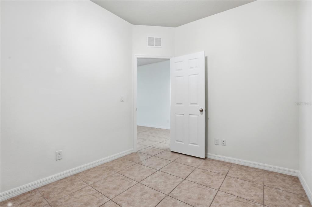 1724 Passage Key Lane Ruskin, FL 33570 - Photo 21 of 46 an empty room with white door
