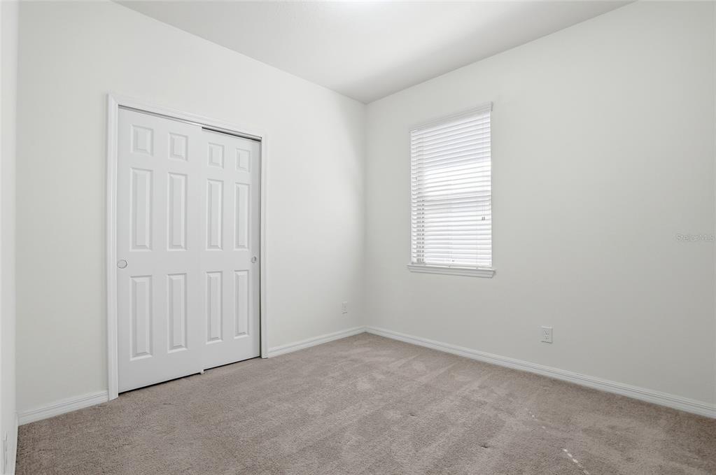1724 Passage Key Lane Ruskin, FL 33570 - Photo 23 of 46 an empty room with windows