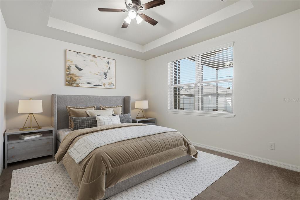 1724 Passage Key Lane Ruskin, FL 33570 - Photo 25 of 46 a bedroom with a bed and a window