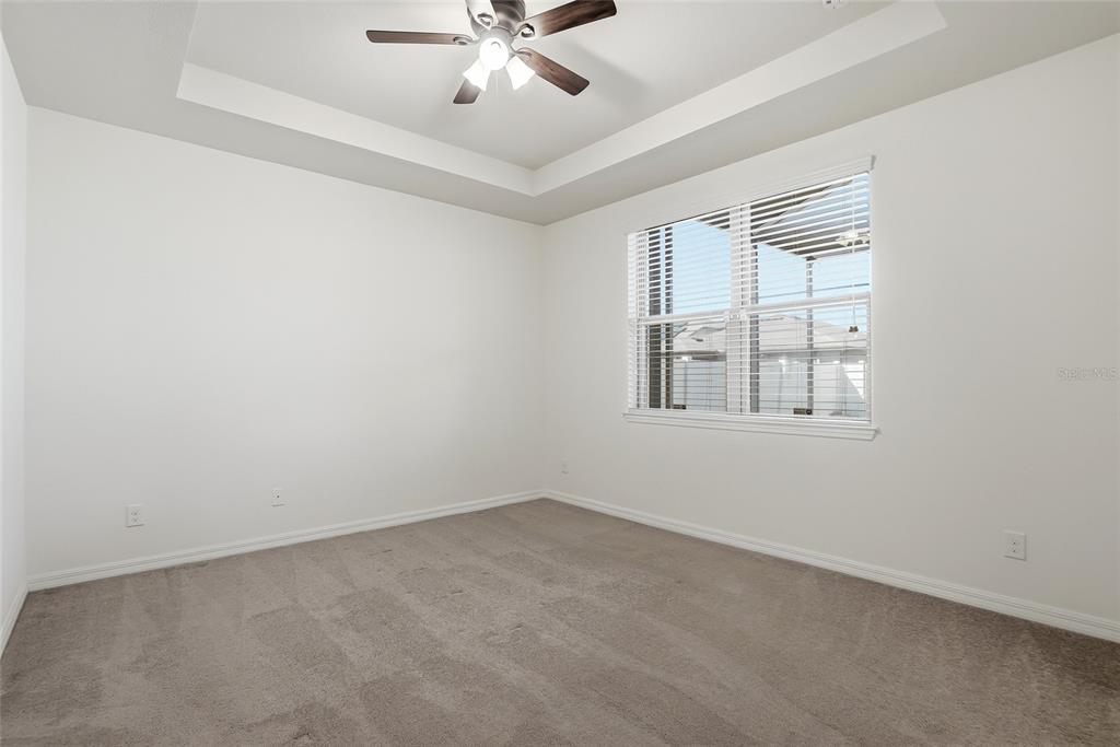 1724 Passage Key Lane Ruskin, FL 33570 - Photo 27 of 46 an empty room with windows and fan