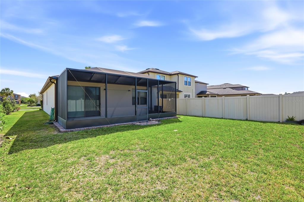 1724 Passage Key Lane Ruskin, FL 33570 - Photo 38 of 46 a view of a house with a backyard