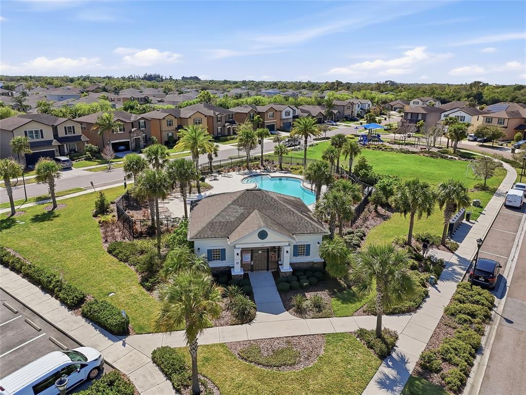 1724 Passage Key Lane Ruskin, FL 33570 - Photo 41 of 46 a view of a city with lawn chairs and large trees