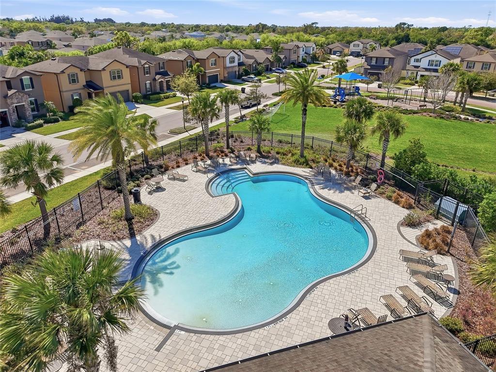 1724 Passage Key Lane Ruskin, FL 33570 - Photo 42 of 46 an aerial view of a swimming pool a yard and mountain view