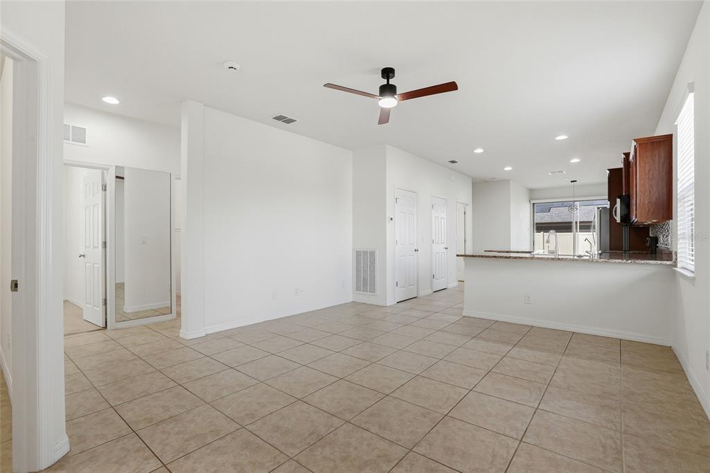 1724 Passage Key Lane Ruskin, FL 33570 - Photo 8 of 46 a view of a kitchen with a refrigerator and a window